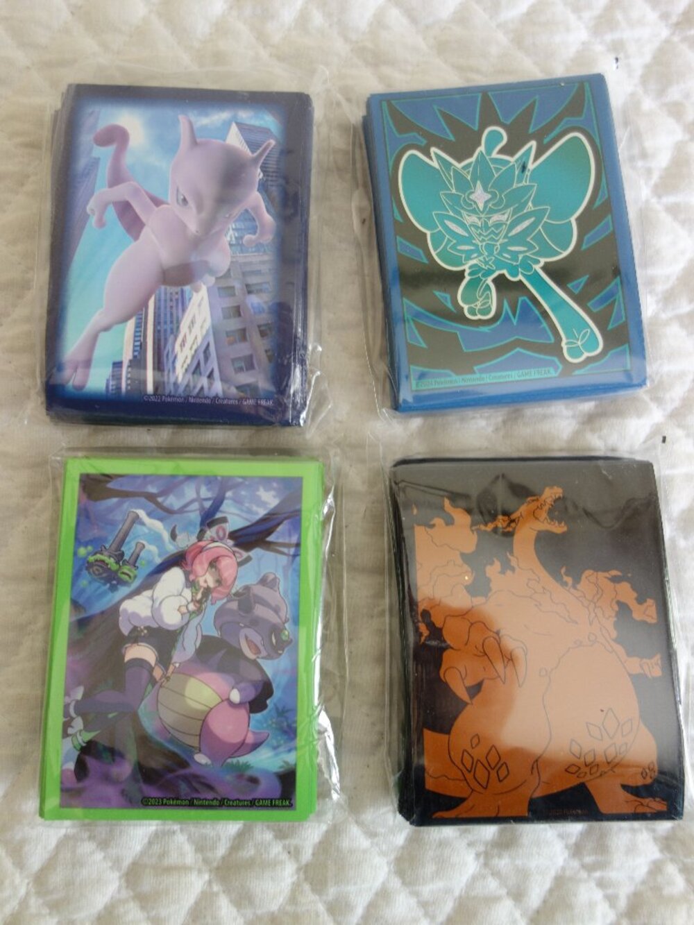 (h)	Lot of 4 NIP 65 count ea POKEMAN Trading Card Sleeves